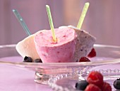 Fruity yoghurt ice lollies with berries and lemon