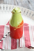 Strawberry and avocado smoothie in a bottle
