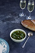 Italian salsa verde served with bread and white wine