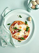 Bismarck pizza with ham, mozzarella and eggs