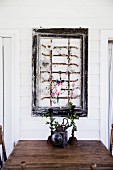 Old window grille in the picture frame as decoration