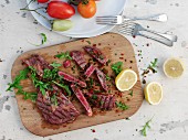 Grilled beef steak on a wooden chopping board