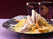 Poached chicken breast on saffron sauce with vegetable strips