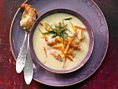 Ginger soup with prawns, carrots and pumpkin