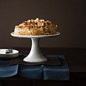 Flaky pastry cake on a cake stand
