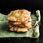 Tostones (fried plantains) on a banana leaf (Latin America)