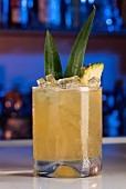 Cocktail with rum, banana, pineapple and lime