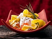 Pasta with a poached egg and caviar