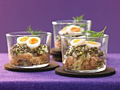 A salmon steak with lentils, quail eggs and honey mustard sauce