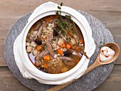 Barley broth with duck, prunes and root vegetables