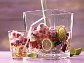 Lime lemonade with berry ice cubes