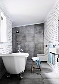 Bathroom with large-format gray tiles on the floor and wall