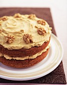 A walnut cake with buttercream icing