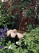 Wall fountain with gargoyle