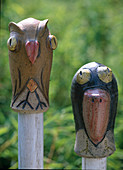 Bird heads made of clay for the garden