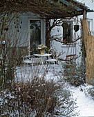 Terrace with pergola in winter
