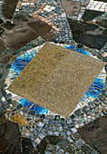 Paving: mosaic around granite slab