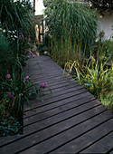 Wooden footbridge Over architectural pond