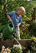 Boy watering