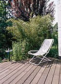 Deck chair on the wooden terrace