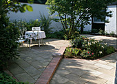 Seating area with paving of Indian sandstone