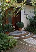 House stairs with clinker and white paving stones