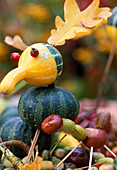Bird made from cucurbita (ornamental pumpkins) and quercus (oak leaves)
