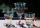 Glass signs as blossoms, fruits, grapes