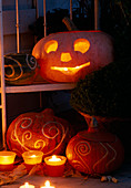 Halloween pumpkins with carved patterns