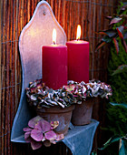 Candles with wreaths of hydrangea flowers