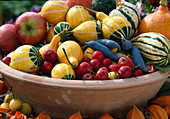 Still life with ornamental pumpkins, ornamental apples, pods