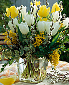 Bouquet with tulips, willow catkins, acacia (mimosa) and book branches