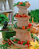 Etagere decorated with clay pots and coasters