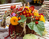 Basket with Helichrysum (strawflower), Helianthus (sunflower), Amaranthus (foxtail)