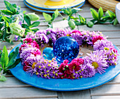 Wreath made of various autumn aster flowers