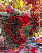Heart-shaped wreath made from Rosa canina (rose hips, thuja twigs)