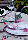 Table decoration: Napkin decorated with brassica (ornamental cabbage leaves), lantern with leaves