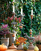 Candlestick pottery, Brassica (ornamental cabbage), Skimmia, Calluna (broom heather)