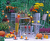 Late summer balcony: fairy lights with candles, tin containers