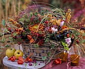 Basket with Chrysanthemum, Hippophae (sea buckthorn), Hedera (ivy)
