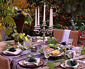 Vitis (vine leaves) and grapes as table decorations, candlesticks, lanterns, glasses