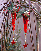 Red glass hanging vases on Salix (catkin willow)