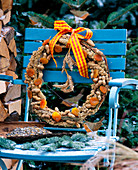 Self made birdseed wreath of millet, apricots and Nobilistanne