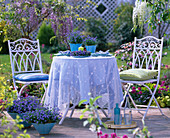 Seating group with forget-me-nots as decoration