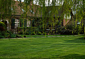 View over lawn to country house