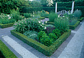 Squares planted with perennials and roses, bordered with box hedges