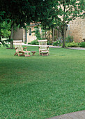 Wooden deckchairs on the lawn