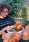 Cleaning pots in autumn for winter storage