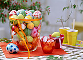 Large glass vase with coloured Easter eggs