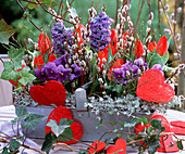 Tin basket with Tulipa 'Red Paradise' (tulips), Hyacinthus (hyacinths), pansies